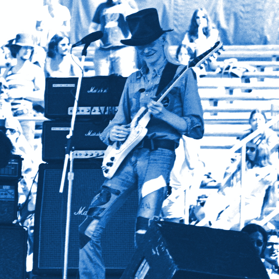 JOHNNY WINTER PERFORMING LIVE IN CONCERT AT "DAY ON THE GREEN" IN OAKLAND, CALIFORNIA ON 9-20-75. PHOTO BY BEN UPHAM. MAGICAL MOMENT PHOTOS.