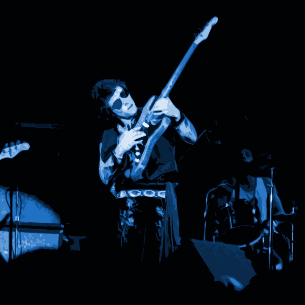 NILS LOFGREN PERFORMING LIVE AT WINTERLAND ON 10-11-75. PHOTO BY BEN UPHAM. MAGICAL MOMENT PHOTOS.